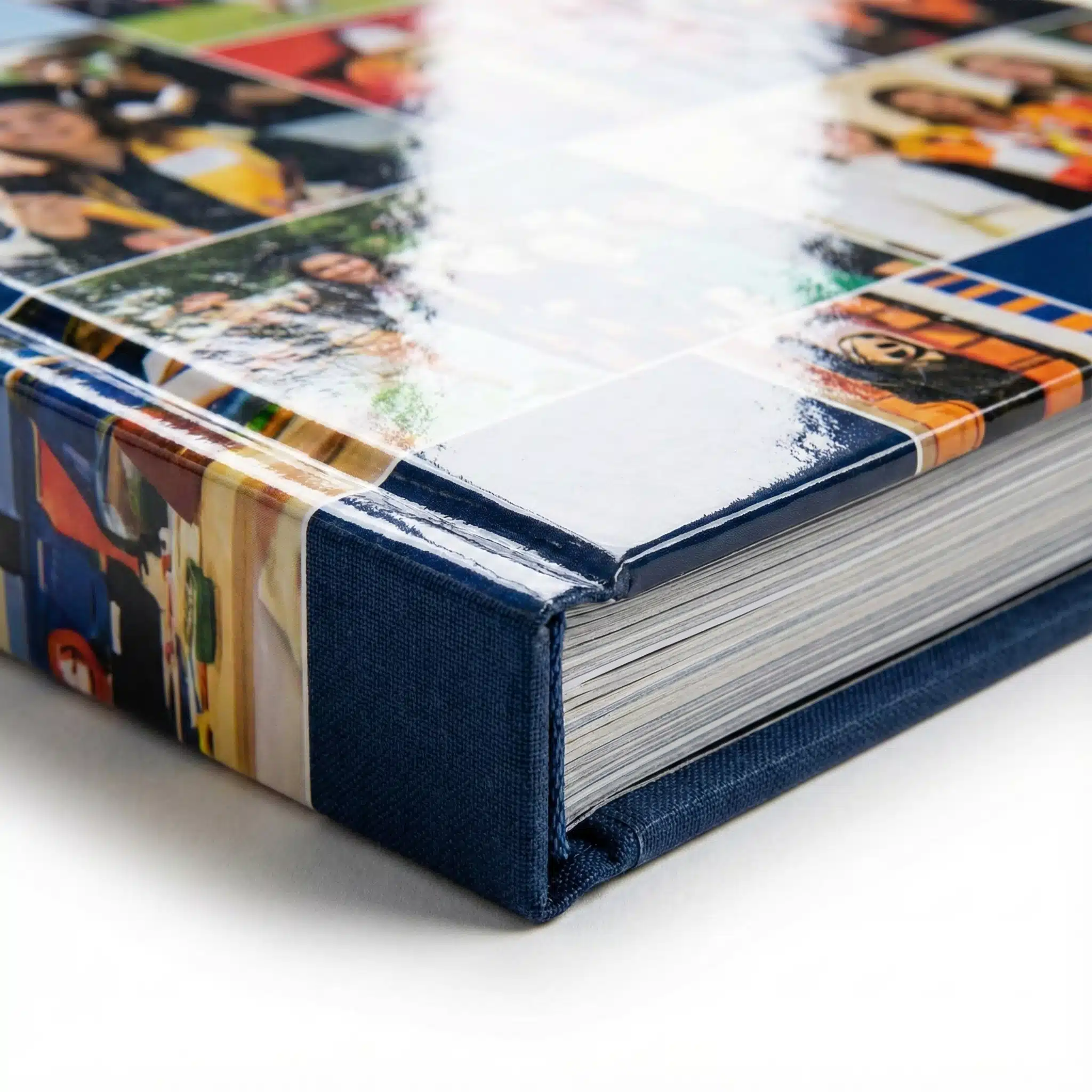 Durable Hardcover Binding Detail Macro shot of a hardcover yearbook corner showing durable binding thickness and cyan endpapers.