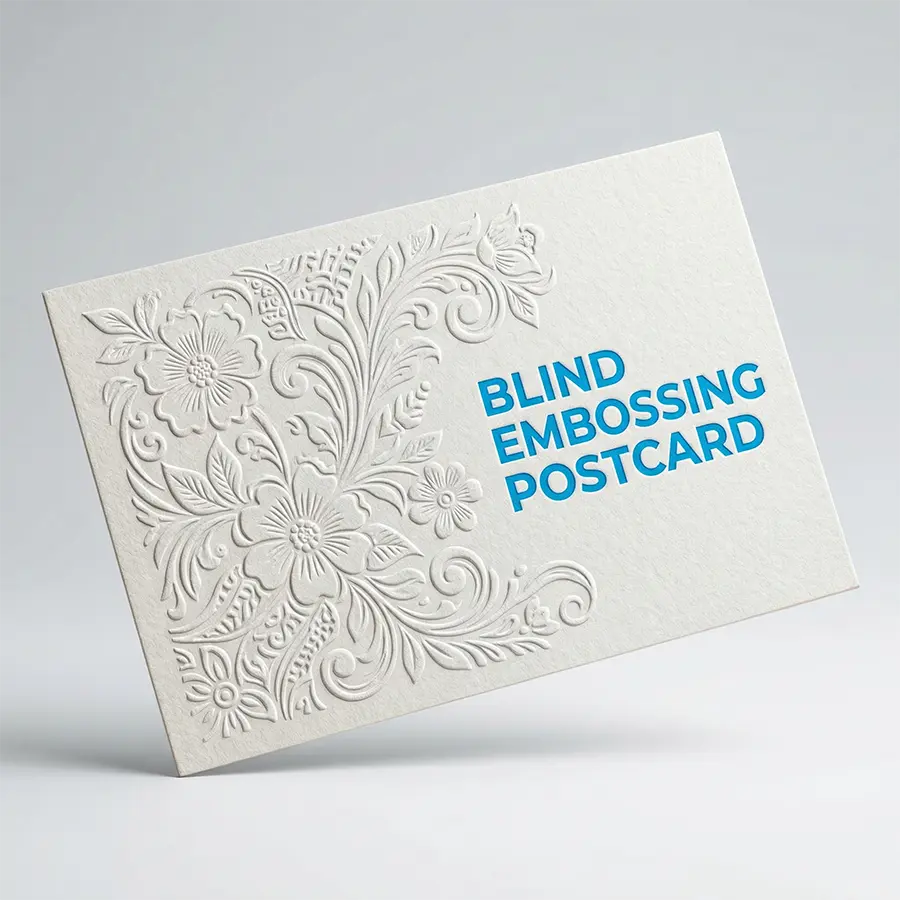 Close-up of a white textured card featuring a blind embossed logo, showing a raised 3D relief pattern without ink or foil.