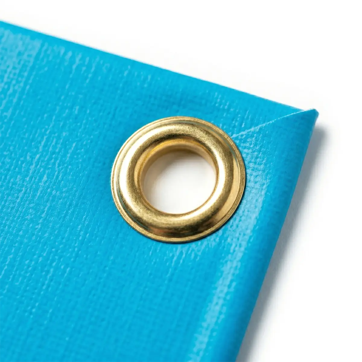 Optional Brass Grommets Heavy duty brass grommet installed on the corner of a vinyl flag pole banner