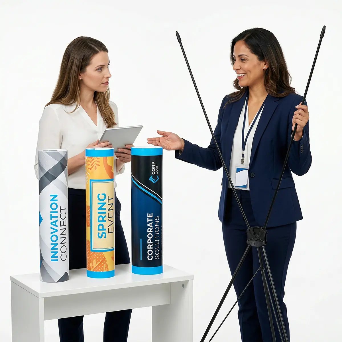 Interchangeable X Banner Graphics Interchangeable custom printed vinyl banners next to an X-frame stand.