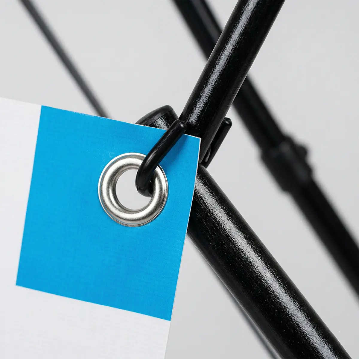 X Banner Grommet Hardware Detail Close-up of corner grommet hardware on a custom X frame banner.