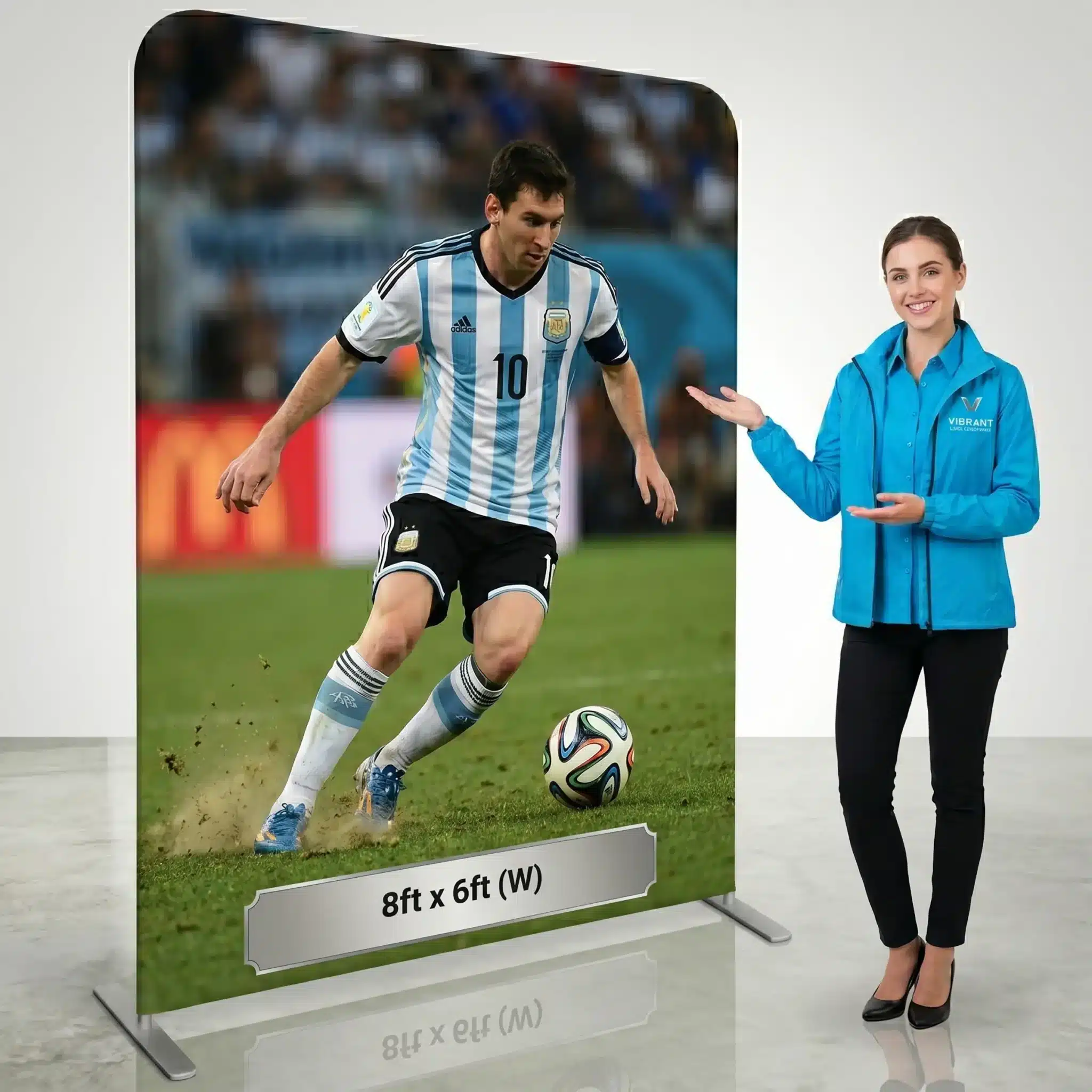 8ft x 6ft pillowcase fabric backdrop, soccer player print and promotional stand A soccer player print fills an 8ft x 6ft pillowcase fabric backdrop beside a presenter in a blue branded shirt from Digital City Printing.