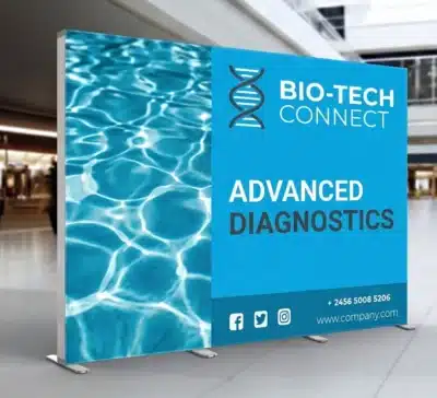 Blue SEG fabric backdrop displaying Bio-Tech Connect Advanced Diagnostics branding in a modern event venue