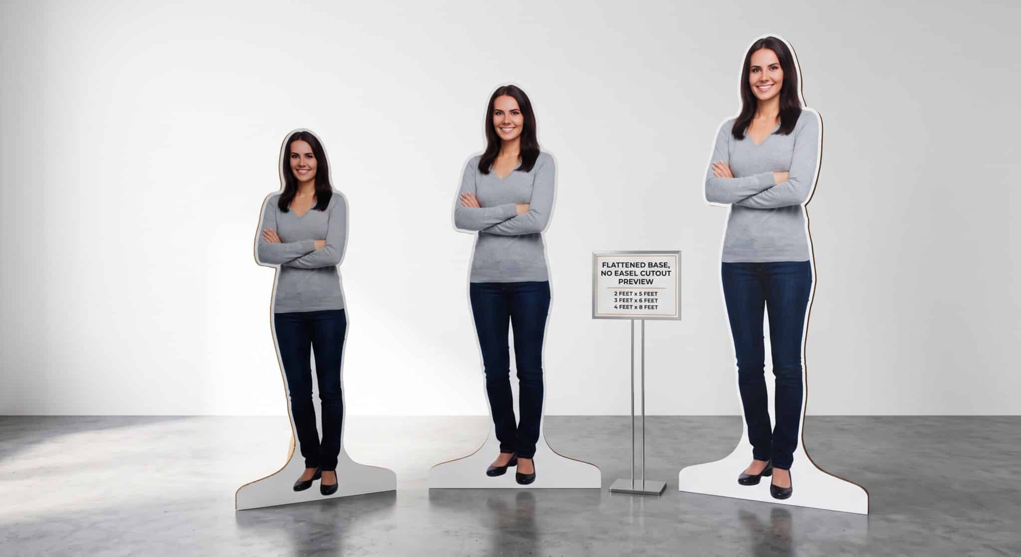 Life Size Cutouts in NYC, Three Standee Sizes Shown Side by Side Three life-size cutouts show a smiling woman with folded arms in a gray top and dark pants, beside a sign listing board sizes.